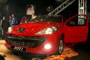 Iran's state-owned car manufacturer Iran Khodro unveils in Tehran on February 20, 2010 for the home market the Peugeot 207i, a locally built version of the French automobile firm's 207 model