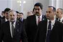 Venezuela's Foreign Minister Maduro walks to the presidential palace in Asuncion with Paraguay's former foreign minister Castro