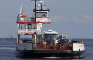 A ferry from Ocracoke Island arrives in Hatteras, N.C., Wednesday, Aug. 24, 2011. A visitor evacuation is underway on Ocracoke Island as Hurricane Irene approaches the Carolinas and the east coast. (AP Photo/Gerry Broome)