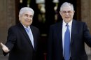 Cyprus' President Dimitris Christofias, left, welcomes the Greek Prime Minister Lucas Papademos before their meeting at the presidential palace in divided capital Nicosia, Cyprus, Thursday, April 5, 2012. Papademos is in Cyprus for two-day official visit. (AP Photo/Petros Karadjias)