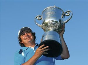 Jason Dufner of the U.S. poses with the Wanamaker trophy after winning the 2013 PGA Championship golf tournament at Oak Hill Country Club in Rochester