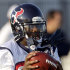 Houston Texans wide receiver Andre Johnson wears his gloves on his face mask as he catches a pass during an NFL football training camp practice Monday, Aug. 1, 2011, in Houston. (AP Photo/David J. Phillip)