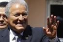 El Salvador's President-elect Salvador Sanchez Ceren waves to the media after his arrival at the presidential palace in Tegucigalpa