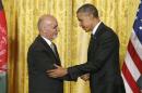 Obama shakes hands with Ghani after their joint news conference at the White House in Washington
