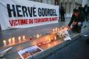 People pay tribute to Gourdel a French mountain guide who was beheaded by an Algerian Islamist group, in Lyon
