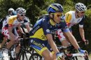 Team Saxo-Tinkoff rider Contador of Spain cycles in the pack during the 213 km first stage of the centenary Tour de France cycling race from Porto-Vecchio to Bastia