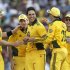 Australian cricketer Mitchell Johnson, center is congratulated by teammates after he took a Sri Lankan wicket during the first One Day International (ODI) cricket match between Sri Lanka and Australia in Pallekele, Sri Lanka, Wednesday, Aug. 10, 2011. (AP Photo)