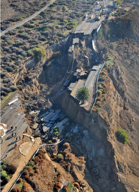 A landslide after Sunday&#39;s heavy rainstorm collapsed a section of a coastal bluff road in San Pedro, seen Monday Nov. 21, 2011. There were no injuries or property damaged. A Los Angeles official