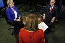 Candidates in New Jersey's contentious and close 3rd Congressional District, Democrat Aimee Belgard, left, and Republican Tom MacArthur, right, appear together to answer questions in joint interview on NJTV with host Marie DeNoia Aronsohn, center, in Trenton, N.J. on Friday, Sept. 26, 2014. (AP Photo/Mel Evans)