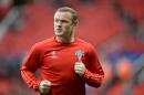 Manchester United's Wayne Rooney warms up before the start of a UEFA Champions League play off football match between Manchester United and Club Brugge at Old Trafford in Manchester, England, on August 18, 2015