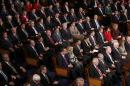 Republican members of congress listen as U.S. President Barack Obama delivers his State of the Union address to a joint session of the U.S. Congress on Capitol Hill in Washington