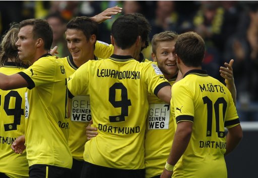 Borussia Dortmund's players celebrate a goal against Bayer Leverkusen during the German first division Bundesliga soccer match in Dortmund