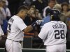 Detroit Tigers' Miguel Cabrera, left, points to teammate Prince Fielder after Fielder's two-run home run during the fifth inning of a baseball game against the Minnesota Twins in Detroit, Tuesday, April 30, 2013. (AP Photo/Carlos Osorio)