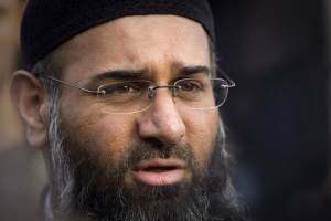Islamic preacher Choudary addresses members of the media during a protest supporting Shari'ah Law in north London