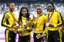 Jamaica's Simpson, Fraser-Pryce, Campbell-Brown and Stewart pose with their silver medals in the women's 4 x 100m relay at the London 2012 Olympic Games in London