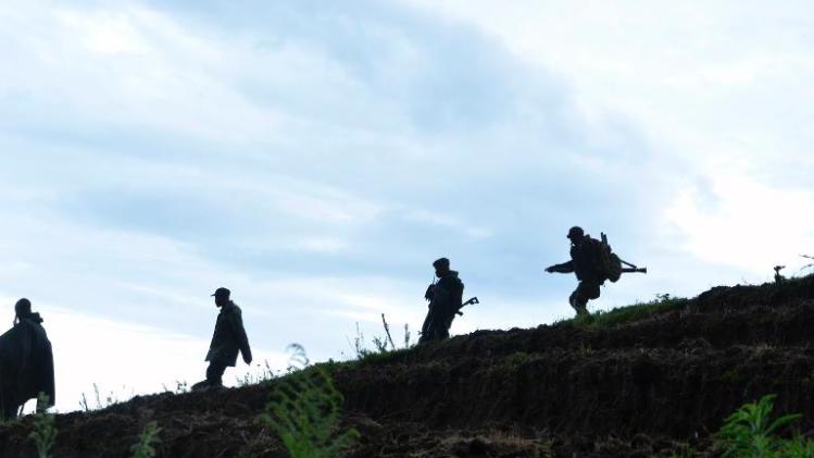 Democratic Republic of Congo soldiers advance on November 5, 2013 near Chanzu, 80 kilometres north of regional capital Goma