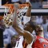Miami Heat's Chris Bosh slam dunks over Chicago Bulls' Joakim Noah during Game 2 of their NBA Eastern Conference semi-final basketball playoff in Miami