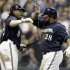 Milwaukee Brewers' Rickie Weeks congratulates Prince Fielder (28) after Fielder hit a home run during the sixth inning of a baseball game against the Colorado Rockies Tuesday, Sept. 13, 2011, in Milwaukee. (AP Photo/Morry Gash)