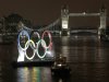 Backdropped by the historic Tower Bridge, a giant Olympic Rings floats on the River Thames in London in the run-up for the Olympic games, during its launch to mark 150-days until the start of the London 2012 Olympic games, Tuesday, Feb. 28, 2012.  (AP Photo/Sang Tan)