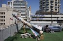 In this image made on Thursday, March 22, 2012, a model of a rocket is displayed on a roof next to the U.S. embassy as part of an art exhibition called 