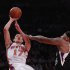 New York Knicks' Jeremy Lin (17) shoots over Sacramento Kings' DeMarcus Cousins during the first half of an NBA basketball game on Wednesday, Feb. 15, 2012, in New York. (AP Photo/Frank Franklin II)