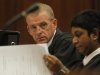State prosecutor Gerrie Nel, prepares for a hearing in the Pretoria, South Africa high court, Thursday, March 28, 2013. The state is opposing the relaxation of bail conditions in the charges against athlete Pistorius who is charged with the shooting death of his girlfriend Reeva Steenkamp last month. (AP Photo/Denis Farrell)