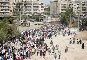 A view is seen of civilians as they walk at the Karaj …