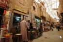 Iraqis shop in Baghdad's historic Saray Bazaar on June 2, 2015
