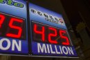 Signage showing the current jackpot of the Powerball outside of a convenience store in Chicago, Wednesday, Aug. 7, 2013. Ticketholders are hoping to win Wednesday's Powerball drawing, estimated at $425 million so far. (AP Photo/Scott Eisen)