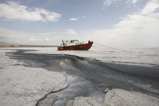 An abandoned boat is stuck in the solidified salts of the Oroumieh Lake, some 370 miles (600 kilometers) northwest of the capital Tehran, Iran, Friday, April 29, 2011. (AP Photo/Vahid Salemi)