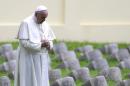 Pope Francis prays at the World War I memorial in Redipuglia, northern Italy, on September 13, 2014
