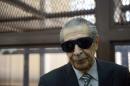 Former Guatemalan President Jose Efrain Rios Montt, wearing dark glasses prescribed after his cataract surgery, is seen during a court hearing in Guatemala city on November 19, 2013