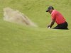 Tiger Woods of the United States hits the ball out of the bunker on the sixth hole on his second attempt at Royal Lytham & St Annes golf club during the final round of the British Open Golf Championship, Lytham St Annes, England Sunday, July  22, 2012. (AP Photo/Peter Morrison)