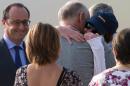 French former hostage Isabelle Prime (R), who was kidnapped in Yemen, embraces her father Jean-Noel Prime upon her arrival at Villacoublay's airbase, near Paris, on August 7, 2015