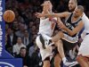 San Antonio Spurs guard Parker slams into New York Knicks guard Prigioni during their NBA basketball game in New York