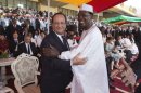 President Francois Hollande greets his Chadian counterpart Idriss Deby Itno on September 19, 2013 in Bamako