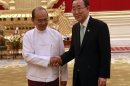 Myanmar President Thein Sein, left, shakes hands with U.N. Secretary-General Ban Ki-moon during their meeting at the presidential house in Naypyitaw, Myanmar Monday, April 30, 2012. Ban is on a three-day visit in Myanmar to see how the world body can help promote the country's tentative steps toward democratic reform. (AP Photo/Khin Maung Win)