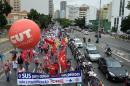Unionists take part in a demonstration called "National Day in Defense of Workers' Rights" in Sao Paulo on April 7, 2015