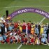 Spain's team players celebrate with the trophy after defeating Italy to win the Euro 2012 final soccer match at the Olympic Stadium in Kiev
