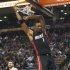 Miami Heat forward Chris Bosh dunks the ball while playing against the Toronto Raptors during first-half NBA basketball game action in Toronto, Friday, March 30, 2012. (AP Photo/The Canadian Press, Nathan Denette)