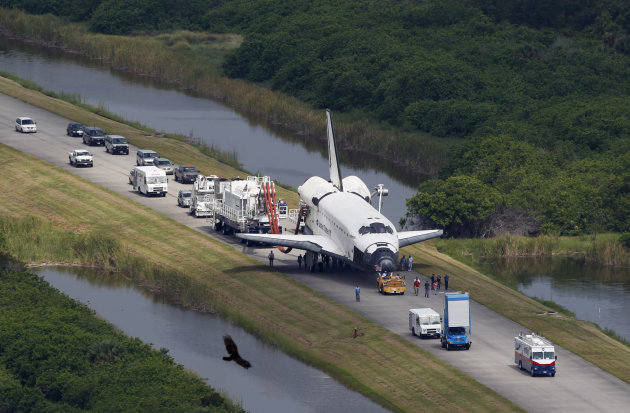 Space shuttle Atlantis is towed to the Orbitor Processing facility for decommissioning at the Kennedy Space Center at Cape Canaveral, Fla., Thursday, July 21, 2011. The landing of Atlantis marks the e