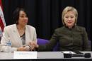 FILE - In this Feb. 7, 2016 file photo, Democratic presidential candidate Hillary Clinton holds the hand of Flint Mayor Karen Weaver during a meeting with officials at the House Of Prayer Missionary Baptist Church in Flint, Mich. Flint, a majority-black impoverished community in a state run by Republicans, has become a dominant issue for the Democratic candidates before Tuesday’s primary in Michigan, so much so that they will return to the city for the seventh Democratic debate on Sunday. (AP Photo/Paul Sancya, File)