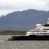 FILE - In this Monday, Jan. 31, 2011 file photo, an helicopter floats on the water close to the Octopus yacht, owned by Microsoft's co-founder Paul Allen, at Ushuaia port, some 3,300 km, about 2045 miles, south of Buenos Aires, Argentina. The Octopus, a mega-yacht owned by Allen, who visited Guam about a week ago, is in the search for a missing Cessna carrying an American pilot and two Palau police officers that was dispatched to track a larger Chinese boat.(AP Photo/Alejandro Madril, File)