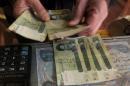 An IMF program will focus on maintaining the peg of the Iraqi currency to the US dollar, while slowly removing exchange restrictions