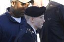 Army Pfc. Bradley Manning is escorted into a courthouse in Fort Meade, Md., Tuesday, June 4, 2013, before the second day of his court martial. Manning is charged with indirectly aiding the enemy by sending troves of classified material to WikiLeaks. He faces up to life in prison. (AP Photo/Patrick Semansky)
