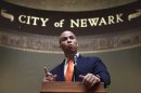 FILE - In this Feb. 23, 2012 file photo, Newark Mayor Cory Booker speaks during a ceremony at City Hall in Newark, N.J. (AP Photo/Seth Wenig, File)