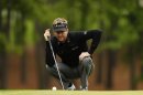 David Lynn of England lines up a putt on the third hole during the final round of the Wells Fargo Championship PGA golf tournament at the Quail Hollow Club in Charlotte