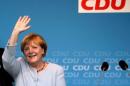 German Chancellor and chairwoman of the CDU Merkel waves during an election campaign rally for local city elections in Berlin