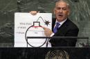 File - In this Sept. 27, 2012, file photo, Prime Minister Benjamin Netanyahu of Israel shows an illustration as he describes his concerns over Iran's nuclear ambitions during his address to the 67th session of the United Nations General Assembly at U.N. headquarters. Israel's Mossad spy agency in October 2012 had a less alarmist view of Iran's nuclear program than an assessment delivered by Netanyahu at the United Nations just a few weeks earlier, according to a purported secret cable published Monday, Feb. 23, 2015, by two media outlets. (AP Photo/Richard Drew, File)