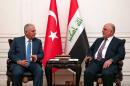 Turkish Prime Minister Binali Yildirim (left) and his Iraqi counterpart Haider al-Abadi hold talks in Baghdad, on January 7, 2017